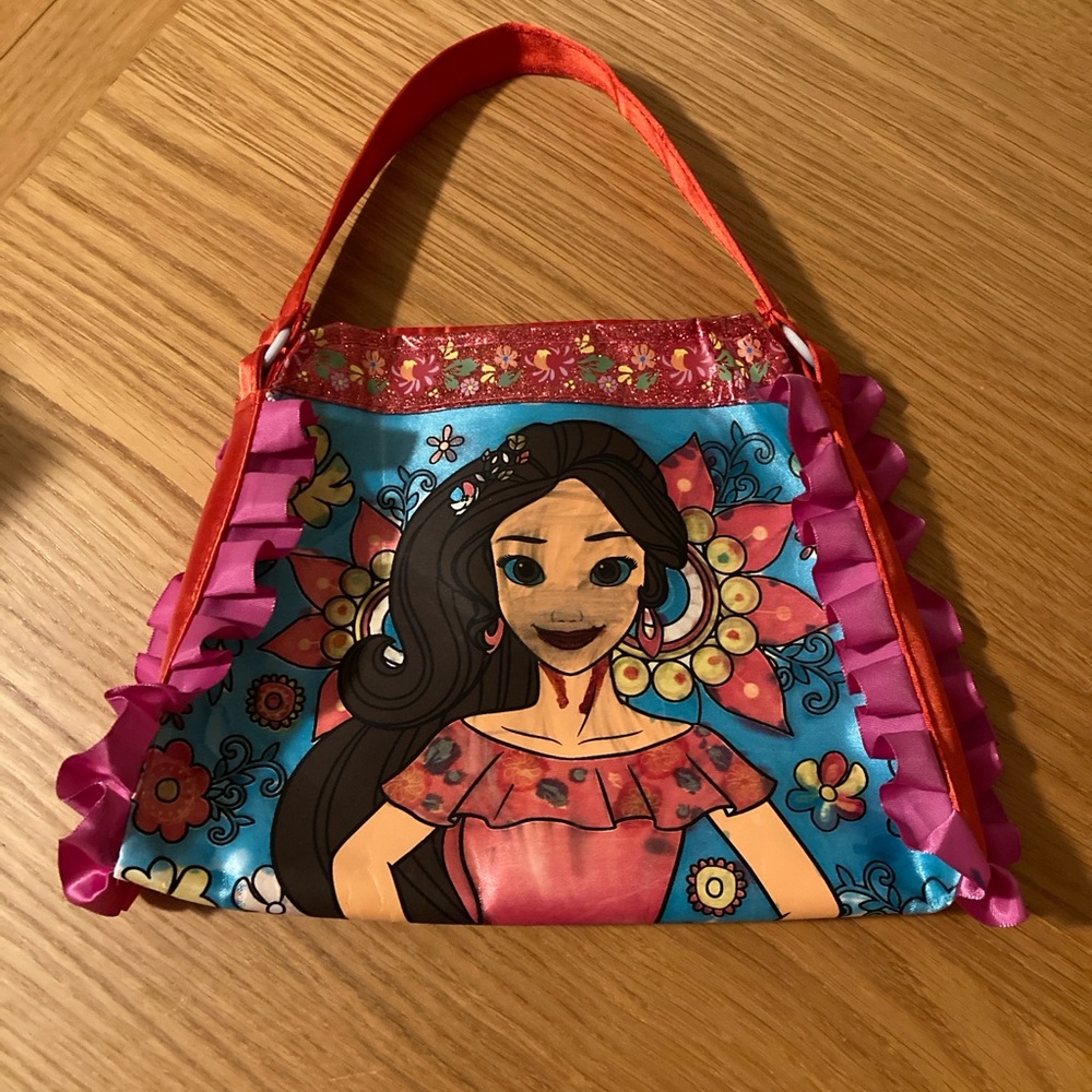 Princess purse or bag. Great for dress up or playtime. Red and pink ruffles